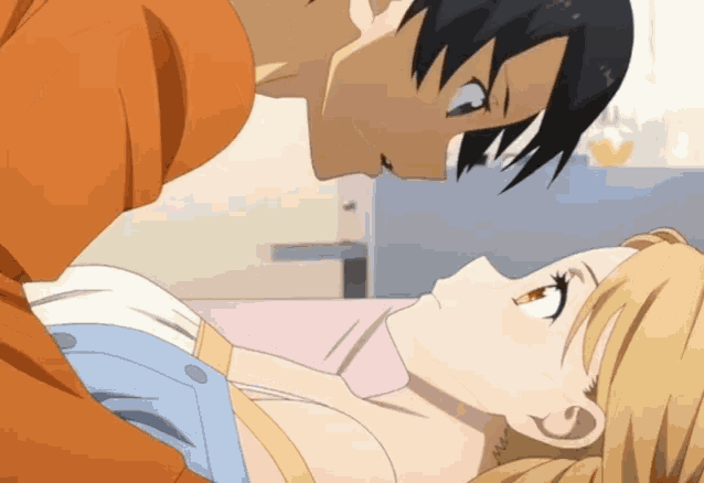 a man and a woman are kissing in a bedroom