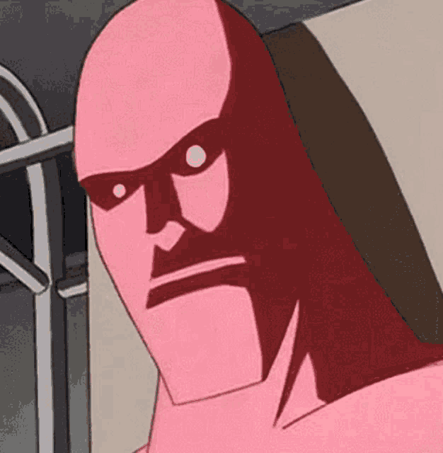 a close up of a pink cartoon character 's face with a serious expression .