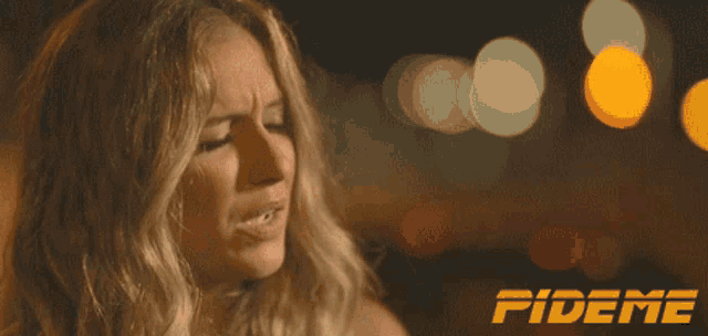 a woman 's face is shown with the word fideme in the upper right corner