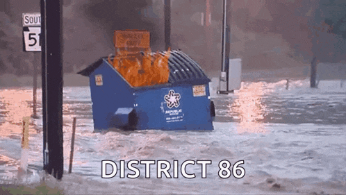 a blue dumpster is floating in a flooded area with the words district 86 written on the bottom