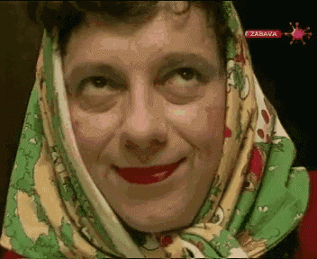 a close up of a woman wearing a scarf around her head with zabava on the bottom right