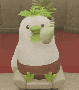a stuffed animal with green leaves on its head