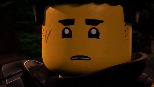a close up of a lego character 's face with a sad expression