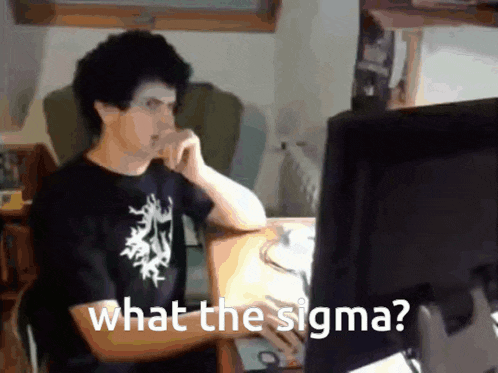 a man is sitting at a desk looking at a computer screen and says " what the sigma "