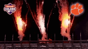 fireworks are going off in front of a logo that says college colors day