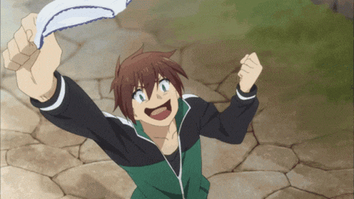 a boy in a green and black jacket is holding a white object in his hand