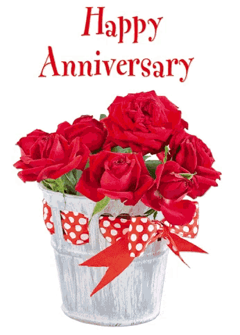 a happy anniversary card with red roses in a tin