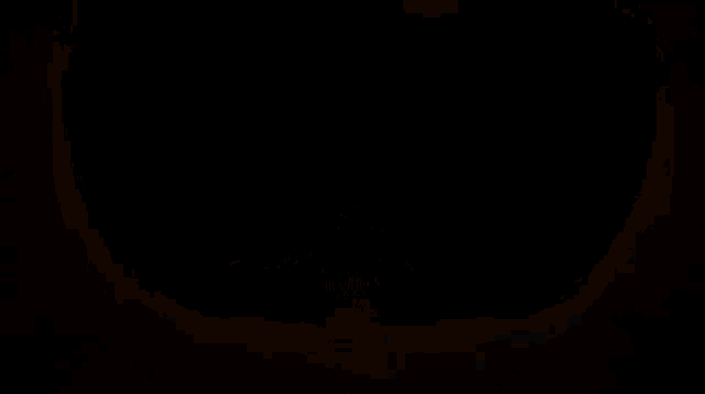 a silhouette of a person with glowing eyes and a smiling face .