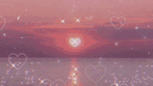 a sunset over a body of water with hearts and stars