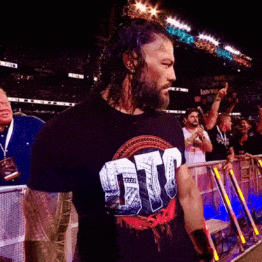 a man wearing a black shirt that says ntt