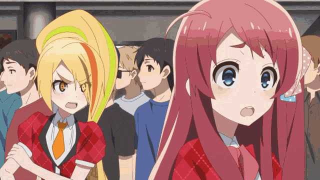 two anime girls are standing next to each other in a crowded area