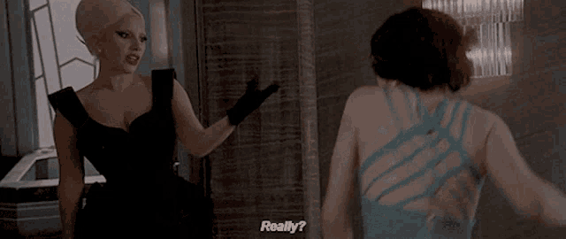 two women are standing next to each other and one of them is asking the other if she is really