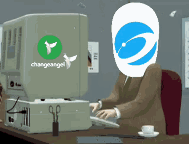 a man sitting at a desk with a changeangel logo on his computer
