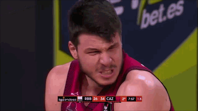 a man wearing a basketball jersey that says liga endesa