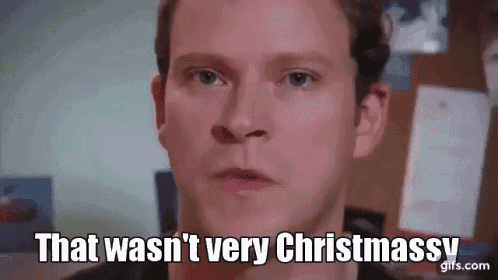 a close up of a man 's face with the words `` that was n't very christmassy '' .
