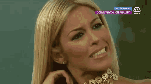 a close up of a woman 's face on a television screen with the words doble tentacion reality on the bottom