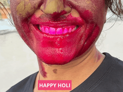 a woman with red paint on her face and the words happy holi below