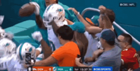 a group of people are watching a football game on cbs nfl