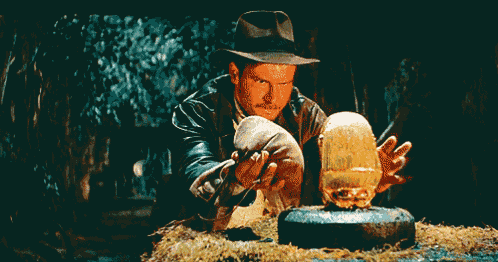 a man in a hat holds a skull in his hands and says tranquilo on the bottom
