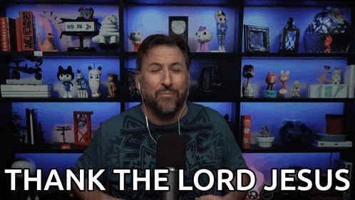 a man says thank the lord jesus in front of a shelf full of stuffed animals