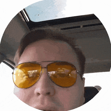 a man wearing a pair of yellow aviator sunglasses
