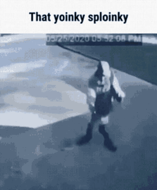 a person is walking down a street with an umbrella and a sign that says that yoinky sploinky