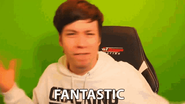 a man wearing a white hoodie that says fantastic