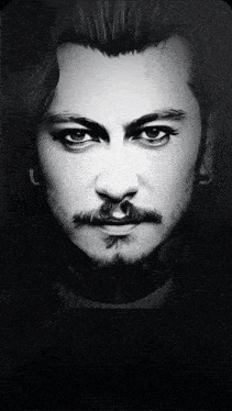 a close up of a man 's face with a beard