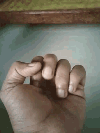 a close up of a person 's hand holding something in it