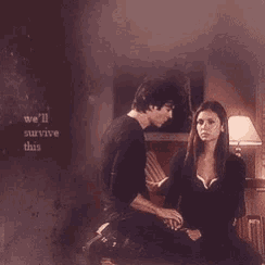 a man and a woman are sitting on a couch with the words we 'll survive this written on the wall