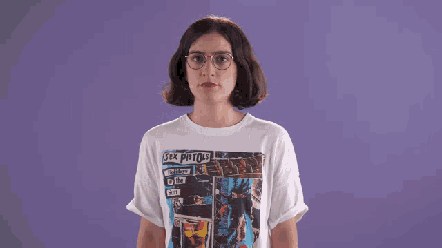 a woman is wearing a sex pistols shirt
