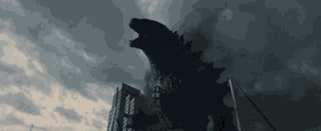 a giant monster is standing in front of a building with its mouth open