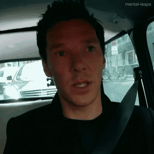 a man in a car with the words mental-leaps on the bottom right