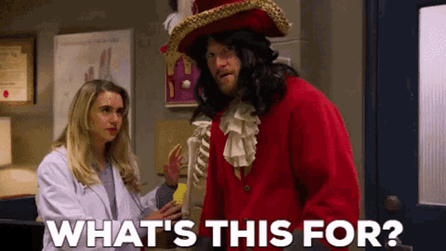 a man in a pirate costume is standing next to a woman in a white coat and asking what 's this for .