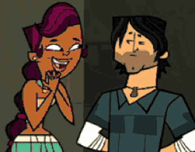 a man and a woman are standing next to each other and the woman is smiling