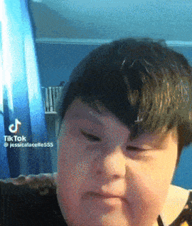 a close up of a person 's face with a tiktok watermark on it