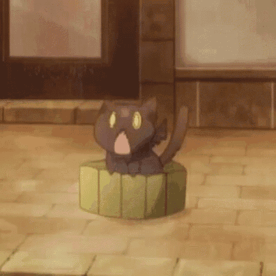 a cat is sitting on top of a green box on a tiled floor .