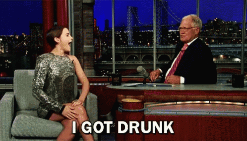a woman sitting in front of a man with the words i got drunk