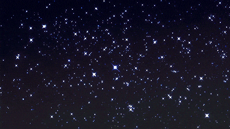 a night sky filled with lots of stars including a small star in the center