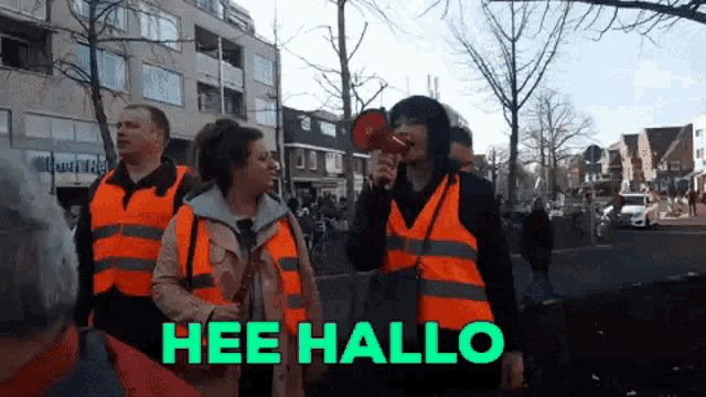 a woman holding a megaphone with the words hee hallo written on the bottom