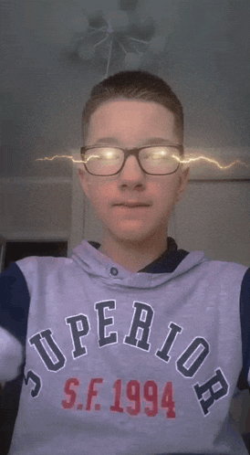 a boy wearing a shirt that says superior s.f. 1994