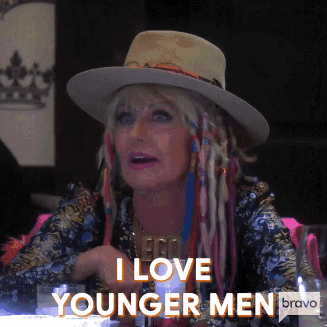 a woman wearing a hat and dreadlocks says i love younger men