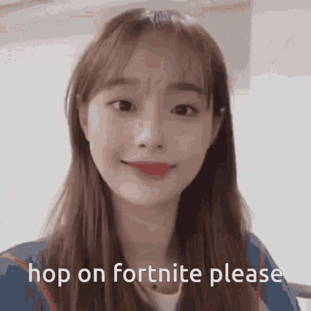 a girl with long hair and red lips is smiling and says hop on fortnite please .