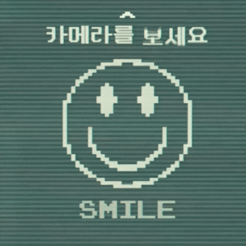 a pixelated smiley face with the words smile written below it