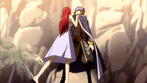 a man and a woman are standing next to each other and the woman has red hair