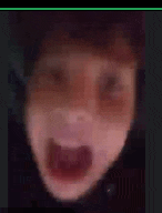 a blurry picture of a person with their mouth open .