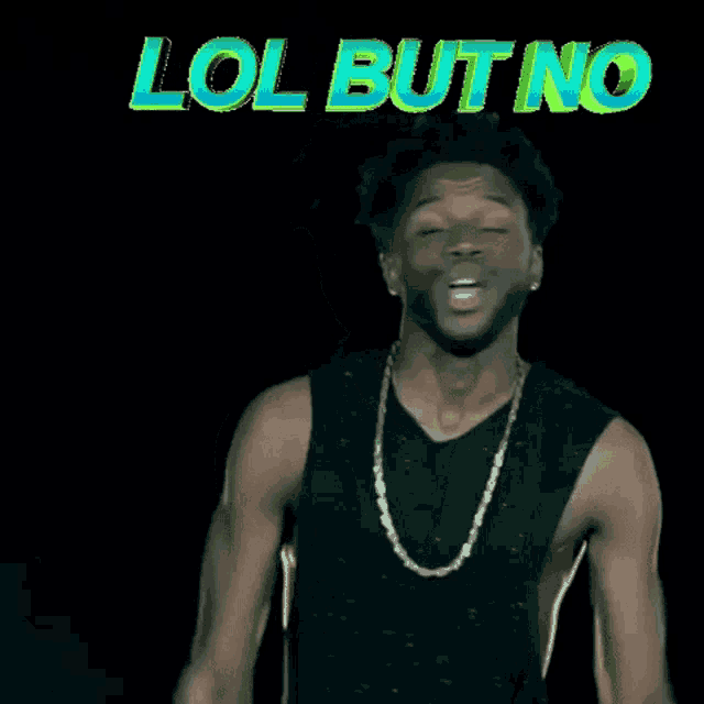 a man wearing a black tank top is smiling and pointing at the camera with the words lol but no behind him