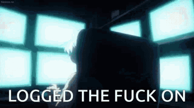a person is sitting in front of a computer monitor with the words `` logged the fuck on '' written on the screen .