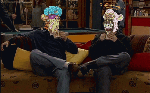 two people sitting on a couch with their faces drawn on their heads