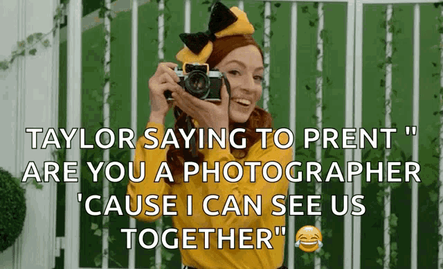 a woman in a yellow shirt is holding a camera and saying " taylor saying to pret are you a photographer